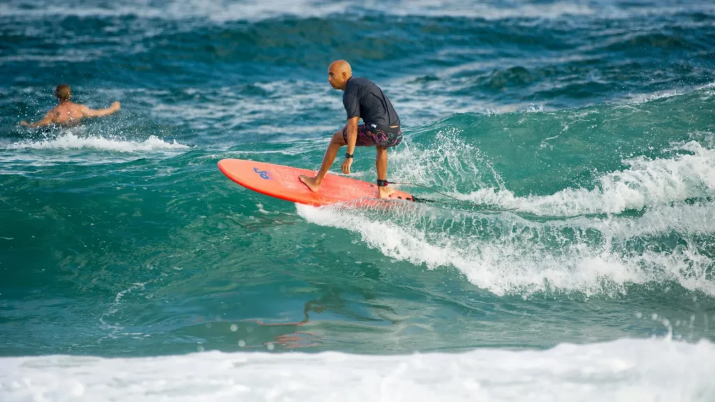 how to stand up on a surfboard