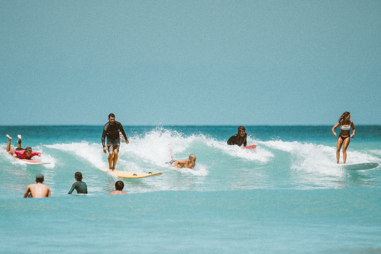 gallery-4 Surfers riding thrilling waves in Honolulu, Hawaii, showcasing vibrant surf culture.